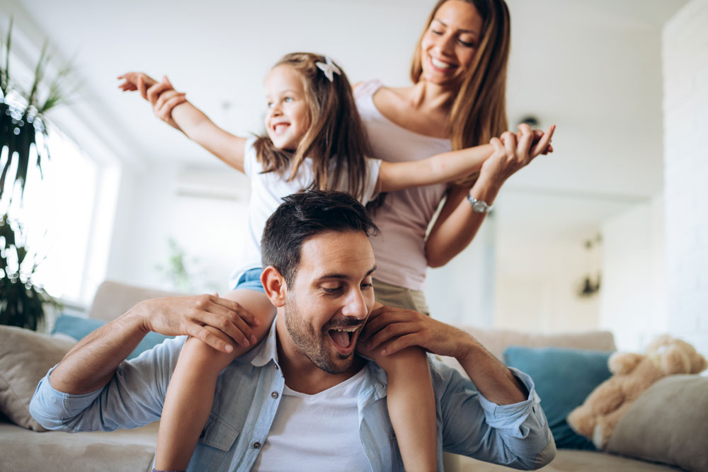 family plays together indoors