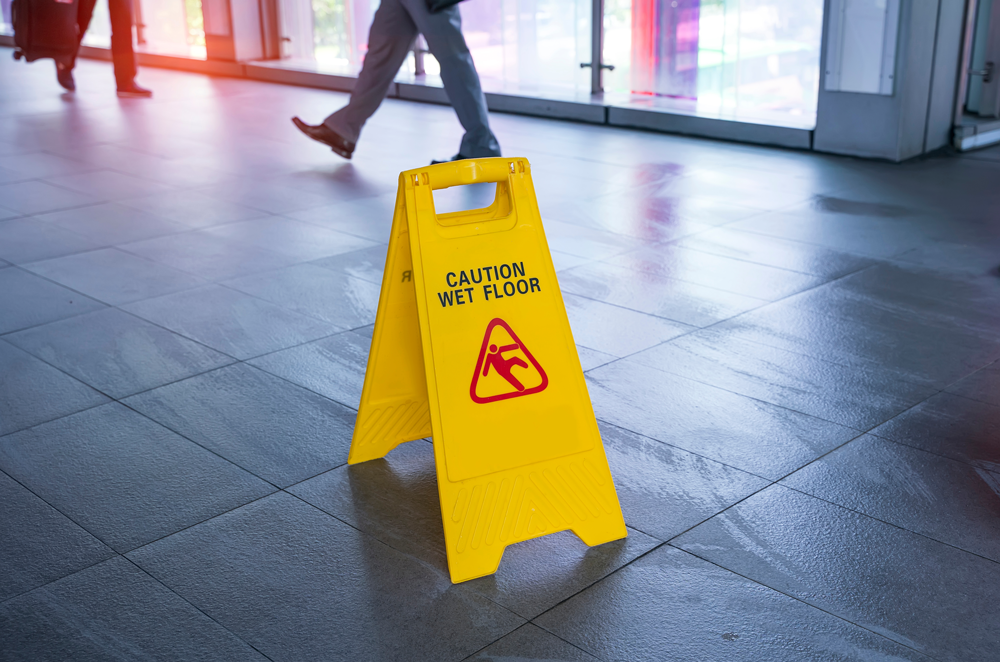 wet floor sign sits on freshly mopped floors